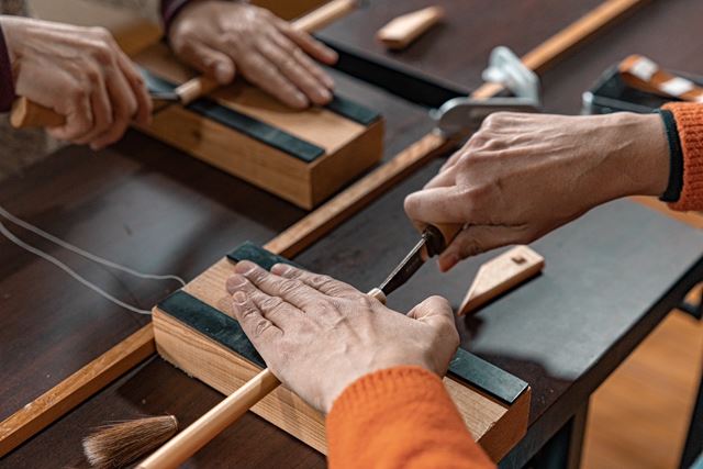 Learning to craft her own brush under the guidance of a master brushmaker in Nara. Image supplied.